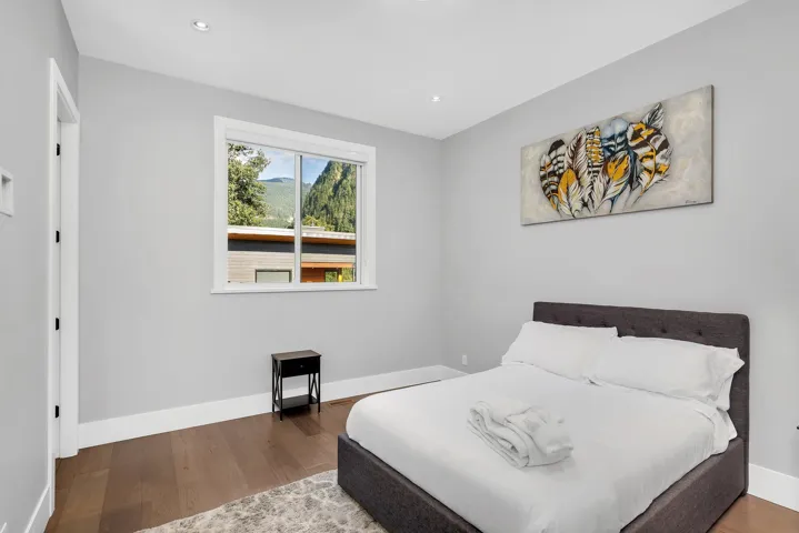 Bedroom featuring wood finished floors and recessed lighting
