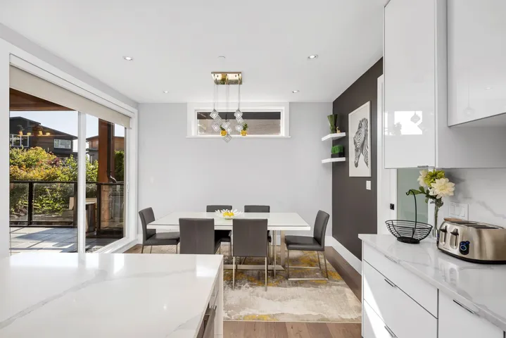 Dining space featuring light wood-style floors, recessed lighting, and a chandelier