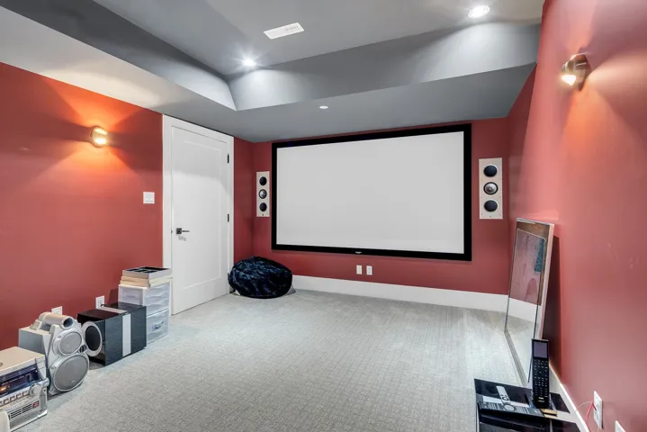 Cinema with carpet floors and recessed lighting