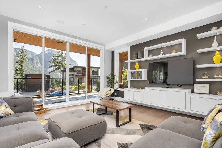 Living room featuring light wood finished floors, a mountain view, and recessed lighting
