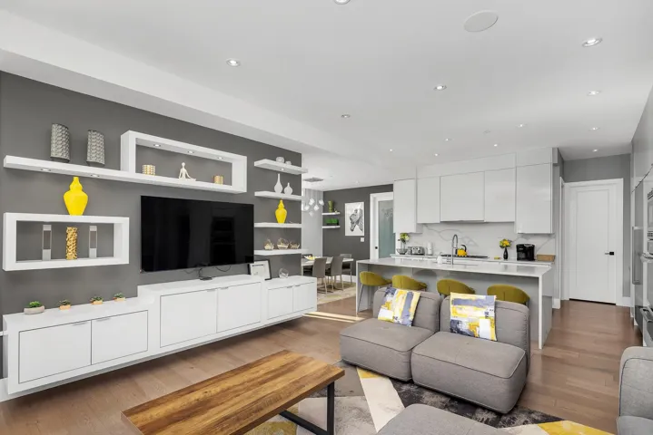 Living room featuring wood finished floors and recessed lighting