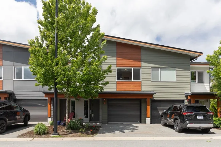Modern home with an attached garage and driveway