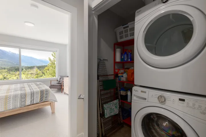 Laundry room featuring estacked washer and dryer