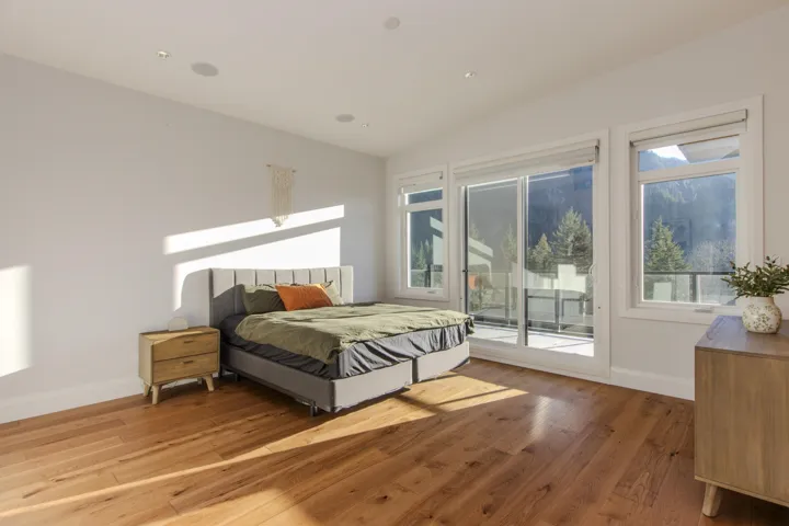 Expansive room featuring wide plank wood-finish flooring and recessed ceiling lighting