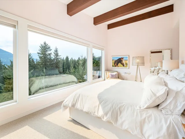 Bedroom featuring carpet flooring and beam ceiling