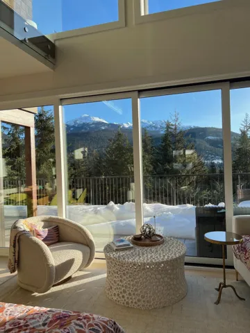Sunroom featuring a mountain view, wood finished floors, and healthy amount of natural light