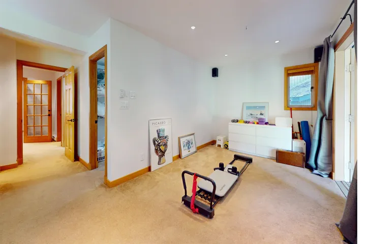 Spacious room featuring carpeting and neutral wall tones