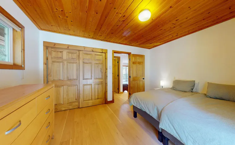 Wood-paneled ceiling with recessed lighting