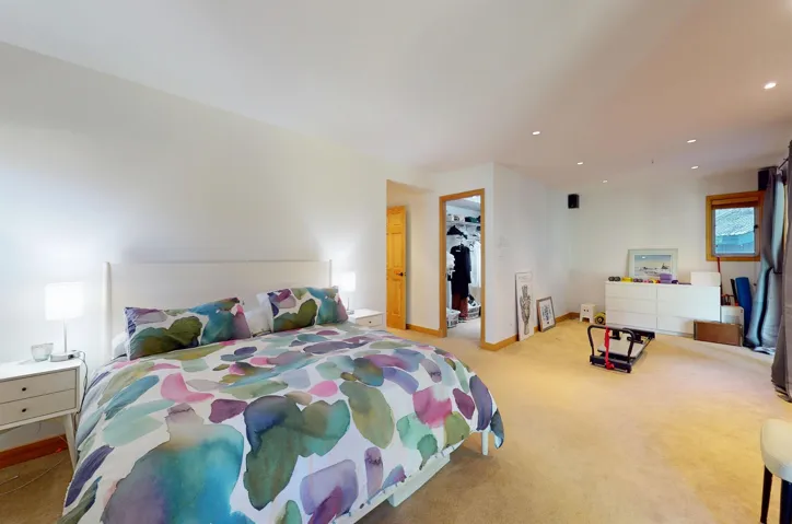 Spacious interior with neutral wall tones and recessed lighting