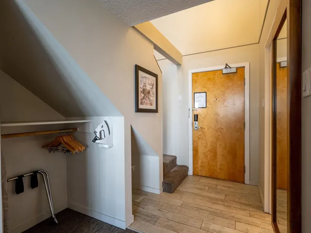 Entrance foyer with wood finished floors and stairway