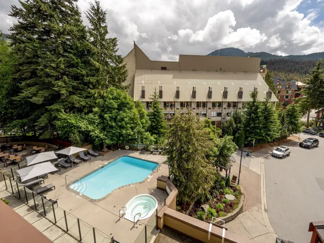 Community pool featuring a patio area and a mountain view