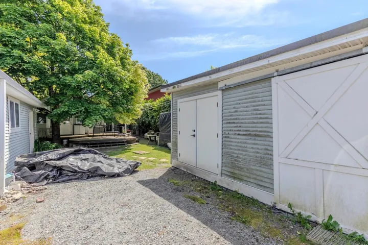 Backyard has lane way access.  Detached garage and a separate storage building.