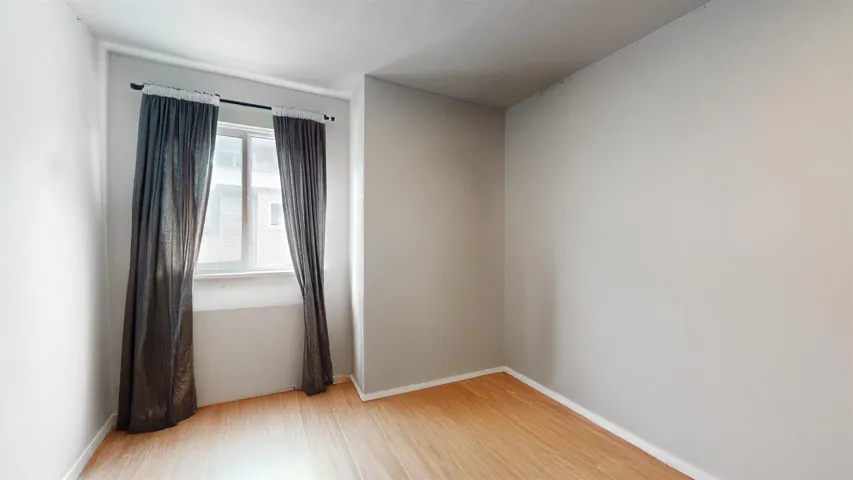 Spare room featuring light wood-style floors