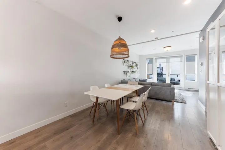 Dining space featuring wood finished floors and recessed lighting