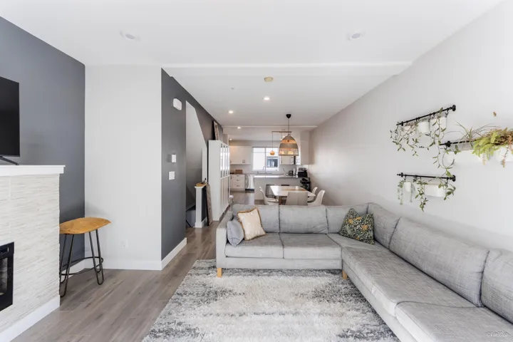 Living room with wood finished floors and recessed lighting