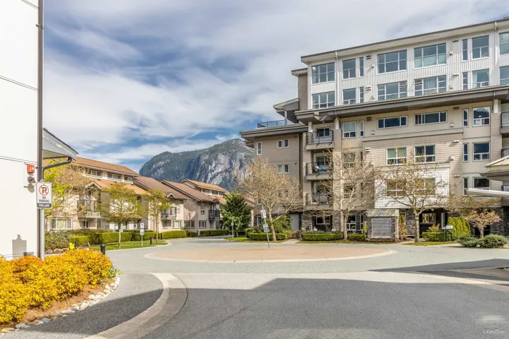 View of building exterior featuring a mountain view and a residential view