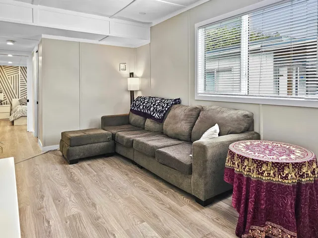 Living area with wood finished floors