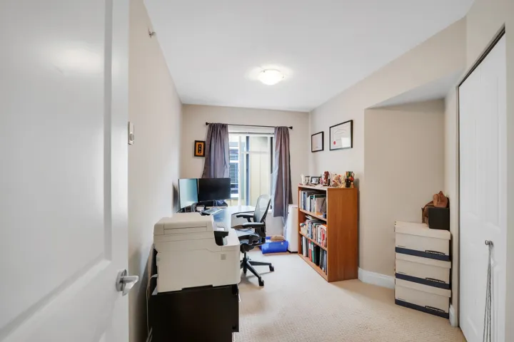 Flexible room featuring light-toned carpeting, a window with drapery, and a white ceiling light fixture