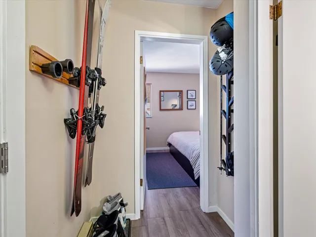 Hall featuring baseboards and wood finished floors