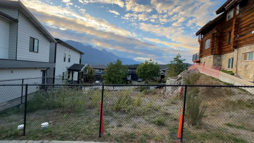 View of yard featuring a balcony, a mountain view, and a residential view
