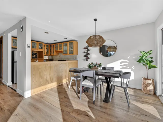 Dining room with baseboards and light wood finished floors