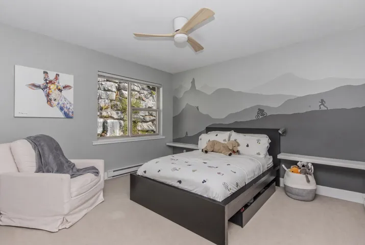 Recessed lighting, wood-finish flooring, and a contemporary ceiling fan