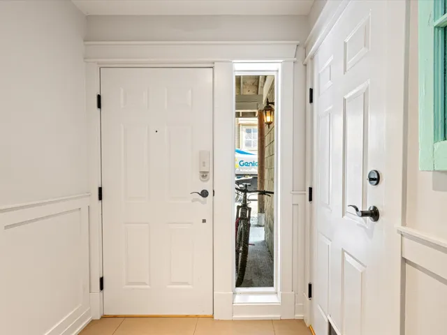 Entrance foyer with light tile patterned floors