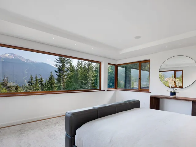 Carpeted bedroom featuring a mountain view and recessed lighting