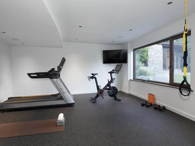 Exercise area with rubber floors and baseboards