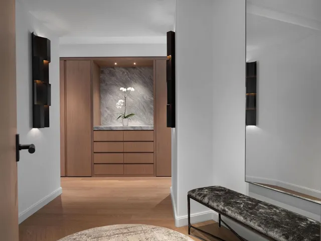 Hall with light wood finished floors and baseboards
