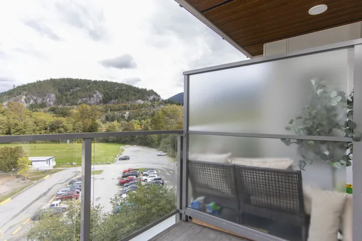 Balcony featuring a mountain view and a forest view