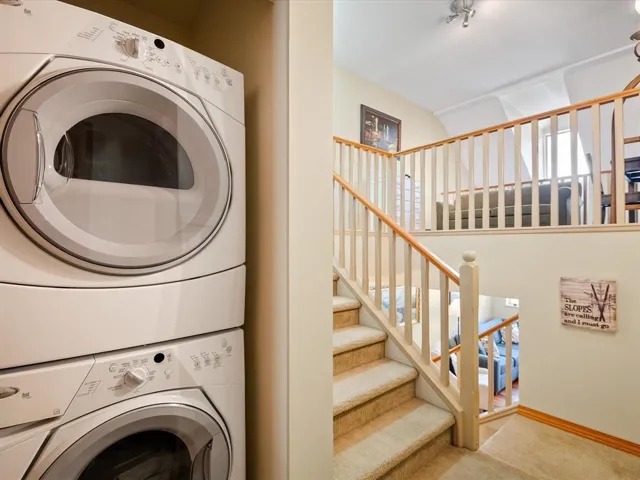 White stacked washer and dryer unit