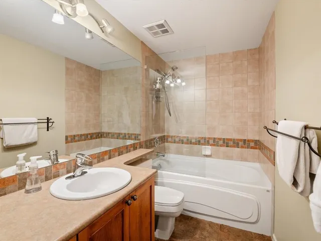 Bathroom featuring a vanity with wood cabinetry and a neutral-toned countertop