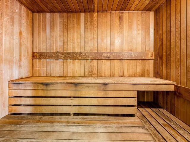 Sauna with wooden ceiling and wood walls