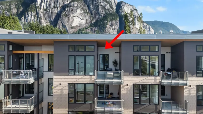 Contemporary multi-story building featuring multiple private balconies with glass railings