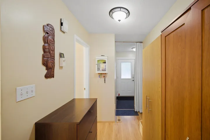 Corridor featuring light wood-style floors