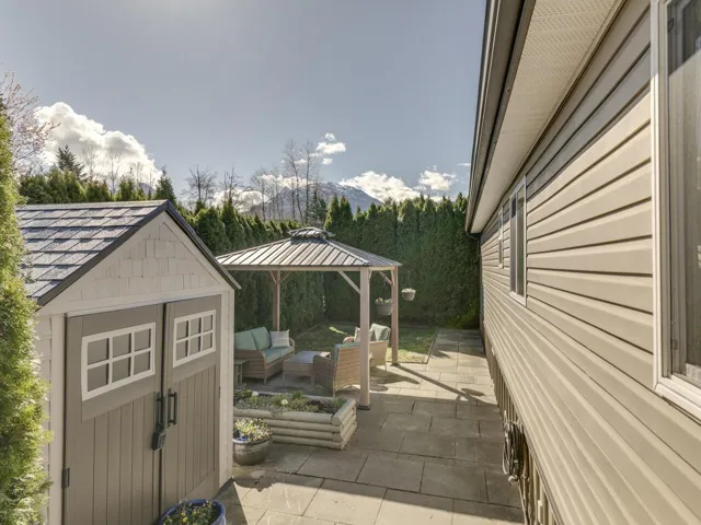 View of patio featuring a gazebo, a storage shed, and outdoor lounge area