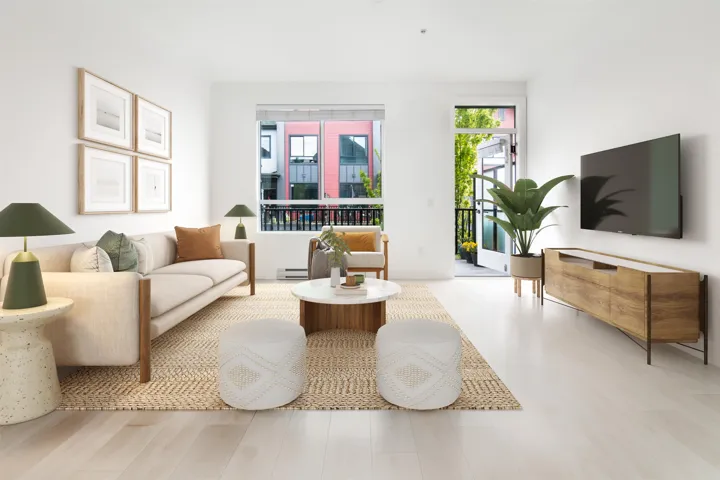 Living room featuring a baseboard heating unit and wood finished floors