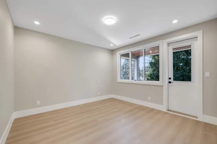 Spare room with light wood-style floors and recessed lighting