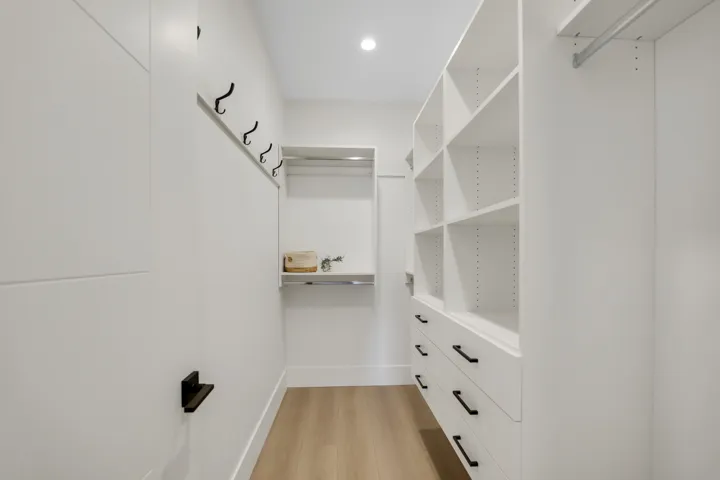 Walk in closet featuring light wood finished floors
