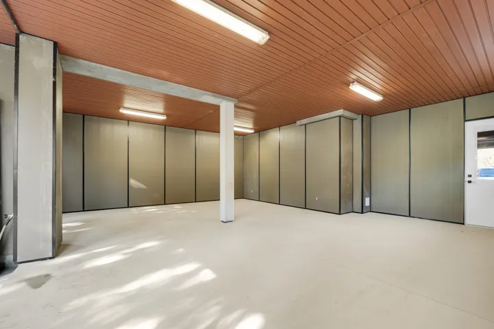 Finished below grade area featuring wood ceiling