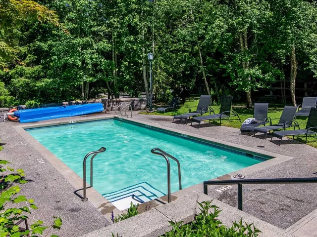 Community pool featuring a patio area
