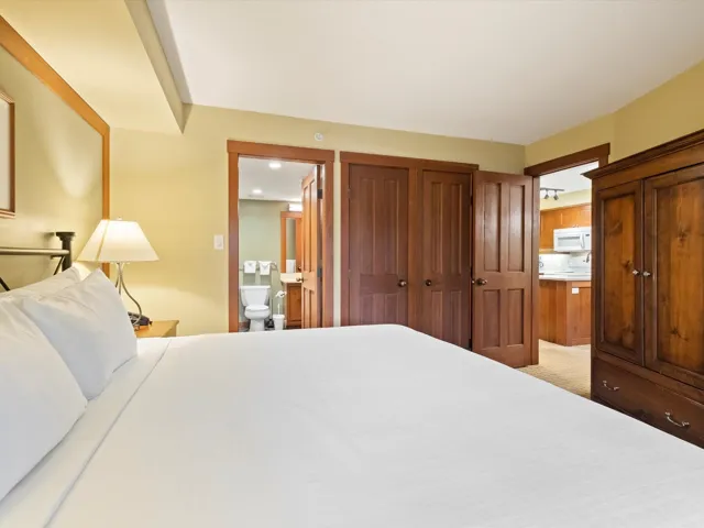 Bedroom with ensuite bathroom and a closet