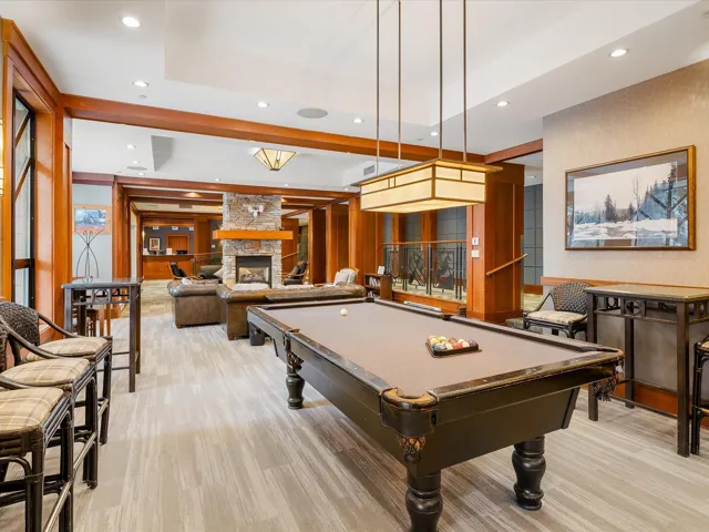 Playroom featuring a stone fireplace, recessed lighting, and billiards
