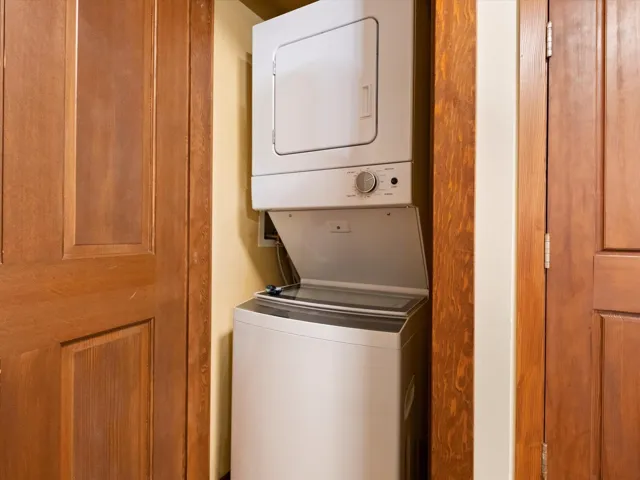 Washroom with stacked washing machine and dryer