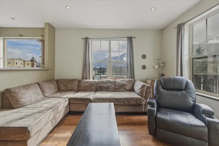 Living room featuring wood finished floors and recessed lighting
