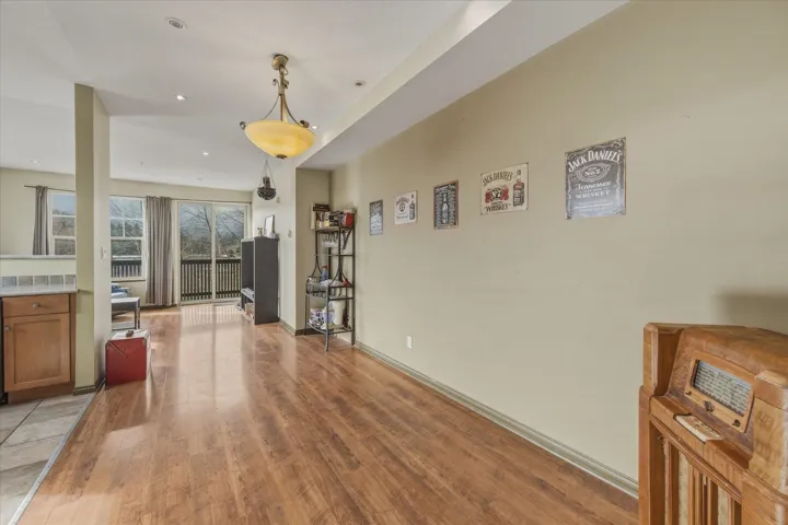Dining space with light wood-style floors and recessed lighting