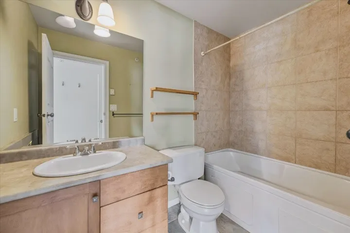 Bathroom with vanity and shower / bath combination