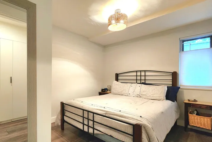Bedroom with wood finished floors