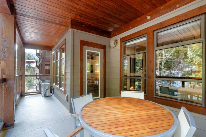 Sunroom featuring wooden ceiling